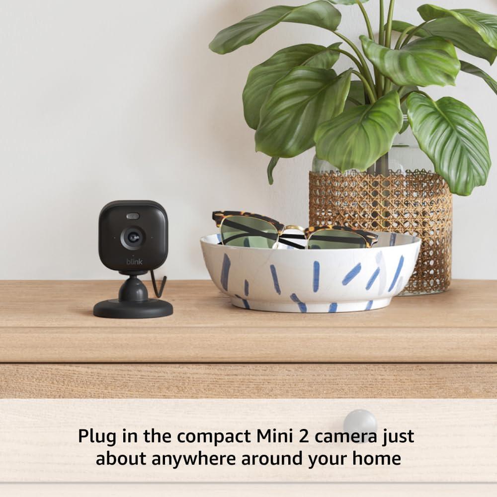 imageBlink Outdoor 4  Mini 2  Wireless smart security camera twoyear battery life 1080p HD day and infrared night live view Sync Module Core included  3 camera system  Mini 2 Black1 Camera System  Mini 2